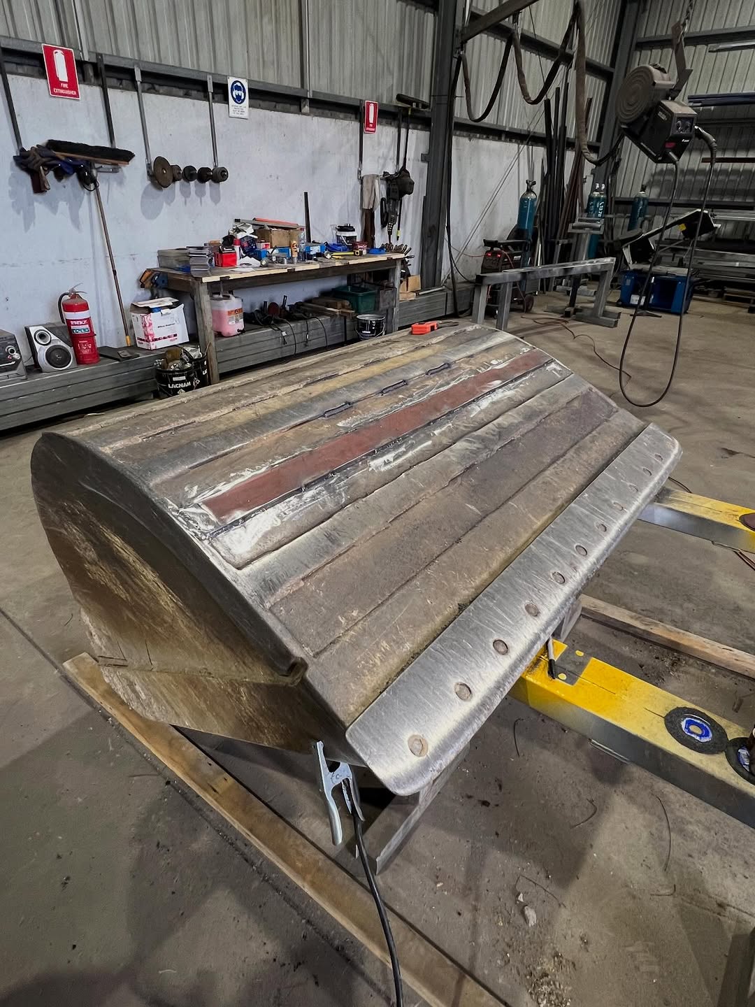 Excavator bucket repair and wear plate replacement